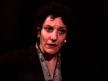 Deborah Auer in EVERYONE MUST TIGHTEN THEIR BELTS - video art.